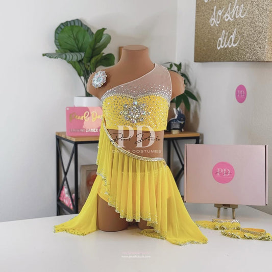 Yellow lyrical dance costume with rhinestone bodice, asymmetrical one shoulder strap, flowing chiffon skirt and crystal embellishments by Pearl Dazzle for competition dancers

Back view yellow lyrical dance costume with open back straps, rhinestone trim and flowing chiffon skirt by Pearl Dazzle dance costumes